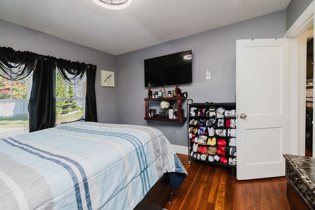 75 Randolph Avenue Tiverton, RI 02878 - Photo 14 of 22 a bedroom with bed and a flat tv screen