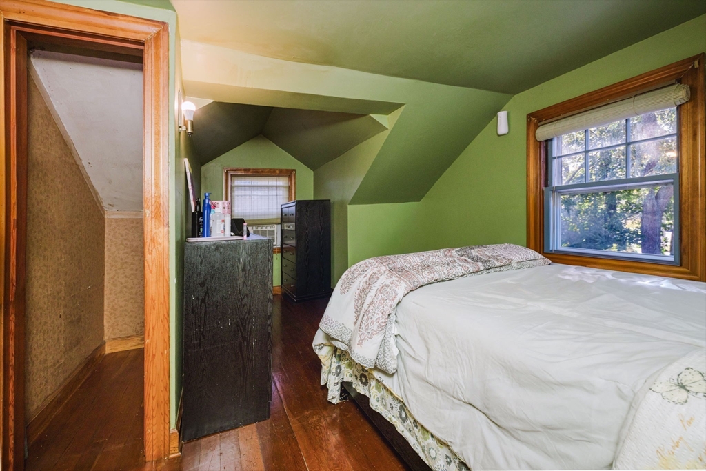75 Randolph Avenue Tiverton, RI 02878 - Photo 17 of 22 a bed sitting in a bedroom next to a window