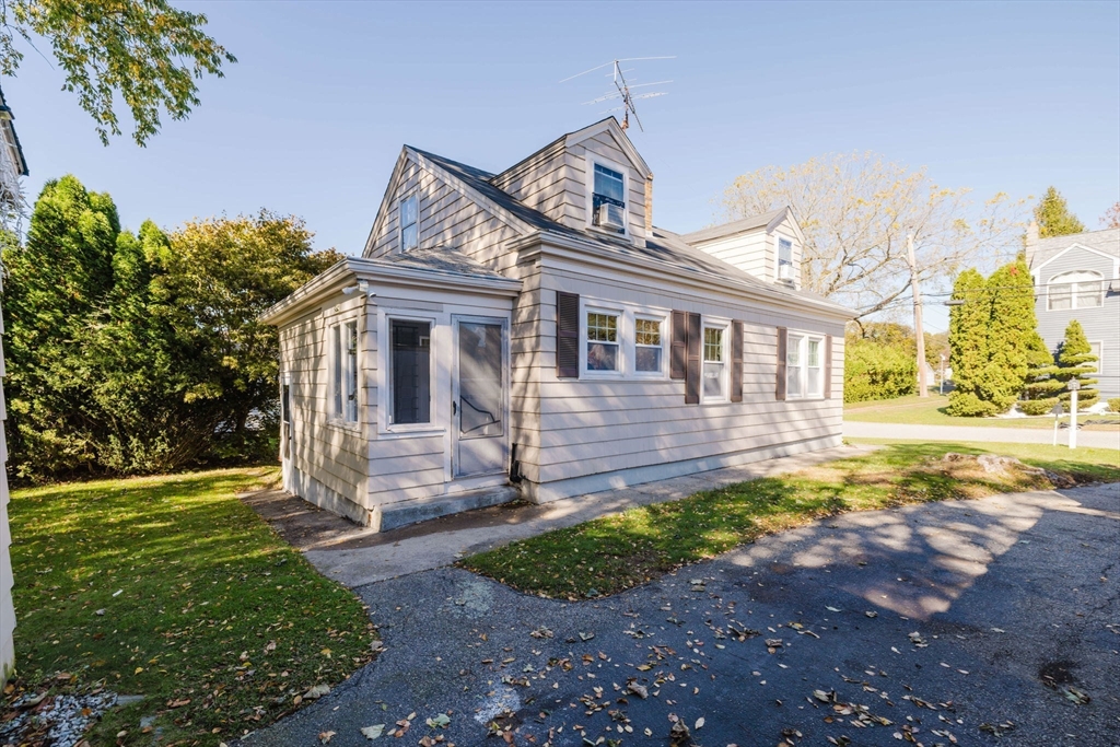 75 Randolph Avenue Tiverton, RI 02878 - Photo 2 of 22 a front view of a house with a yard