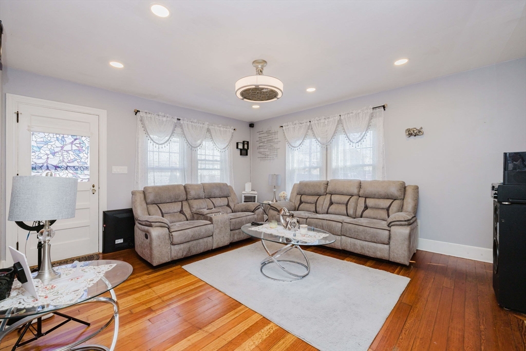 75 Randolph Avenue Tiverton, RI 02878 - Photo 5 of 22 a living room with furniture and a wooden floor