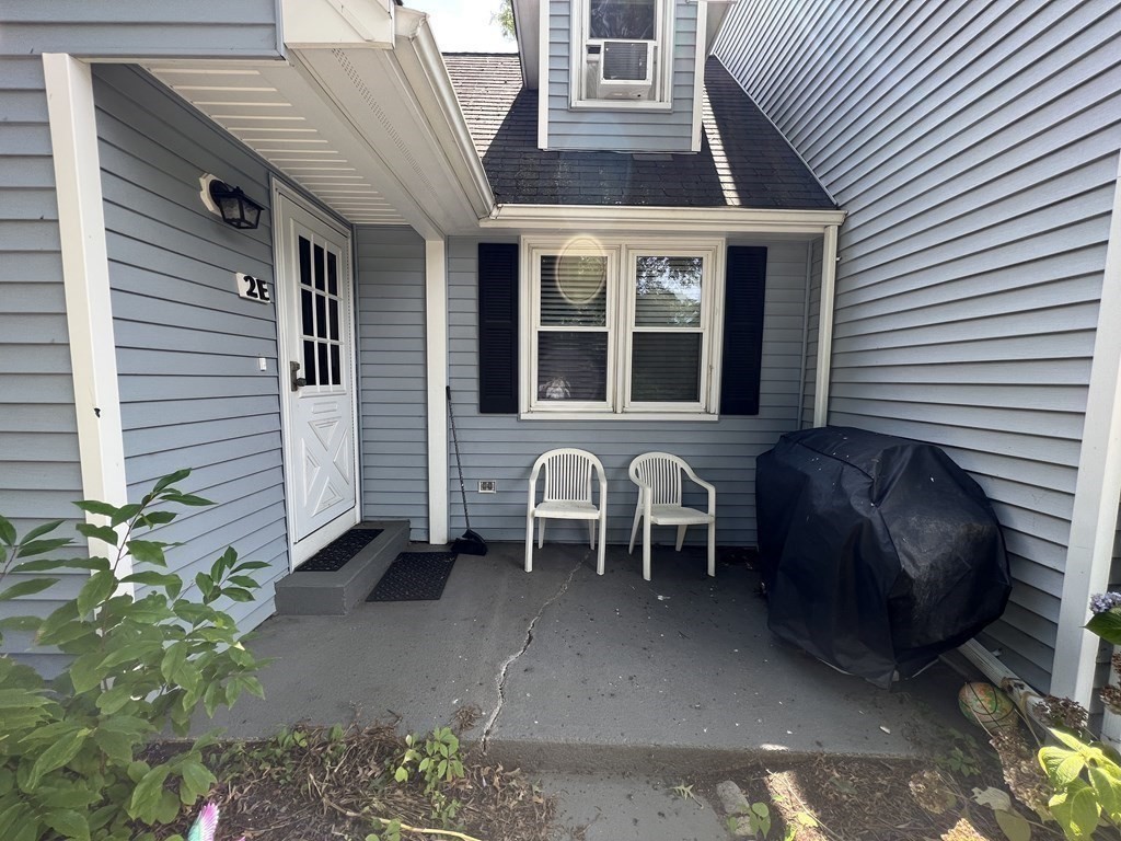 12 State Road, Unit 2E Plymouth, MA 02360 - Photo 24 of 28 a front view of a house with a garden