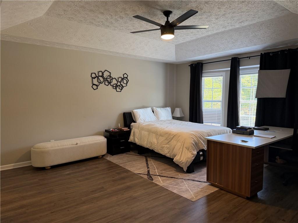 934 Bay Ridge Drive Lawrenceville, GA 30045 - Photo 50 of 78 a bed sitting in a spacious bedroom next to a window