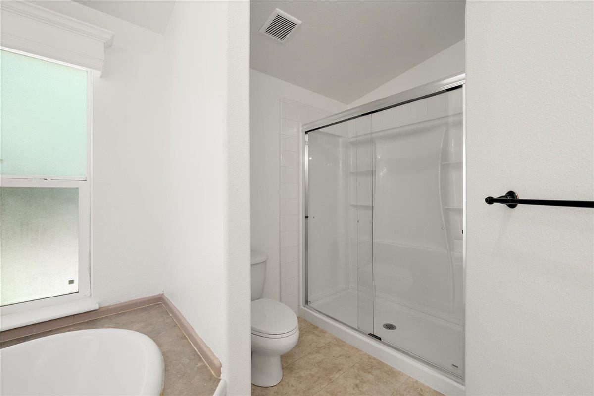 21819 Todd Valley Road Foresthill, CA 95631 - Photo 27 of 37 a bathroom with a granite countertop sink toilet and shower