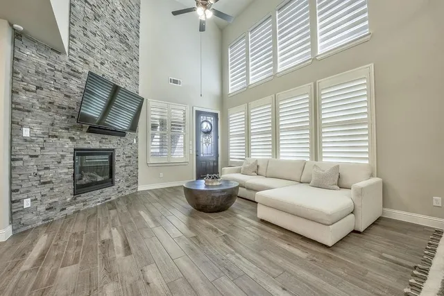 a living room with furniture and a fireplace