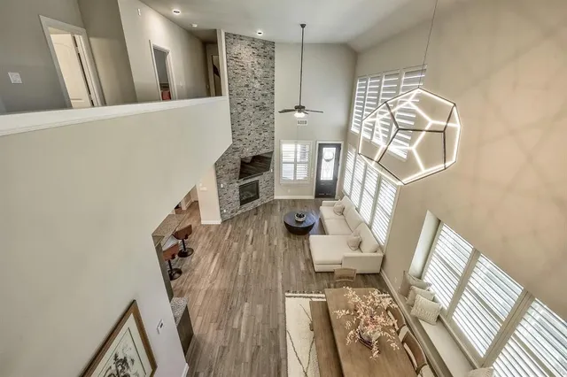 a white bath tub sitting in a bathroom next to a window
