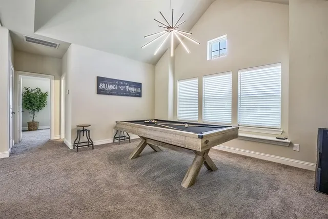 a view of a living room with furniture and a fireplace