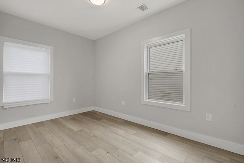626 South 20th Street, Unit 3 Newark, NJ 07103 - Photo 5 of 13 an empty room with a window