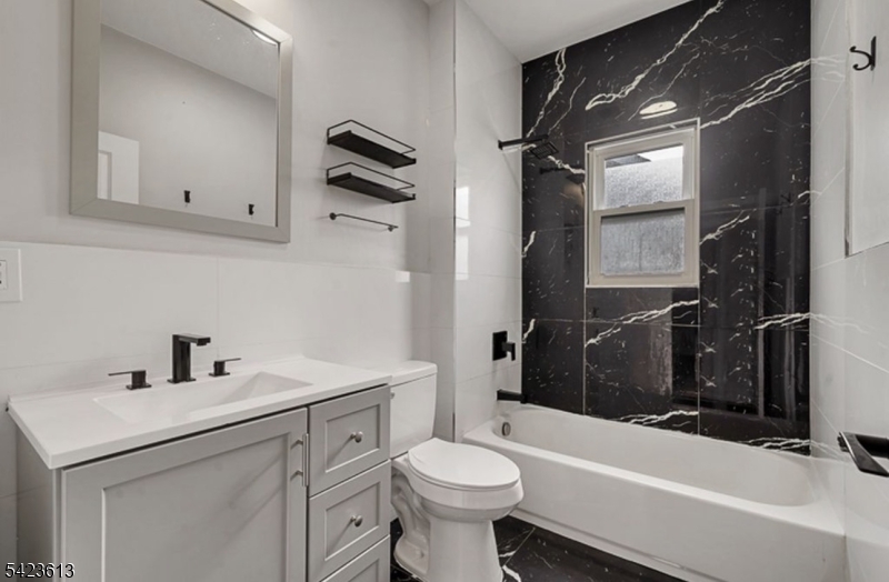 626 South 20th Street, Unit 3 Newark, NJ 07103 - Photo 6 of 13 a bathroom with a sink toilet and shower