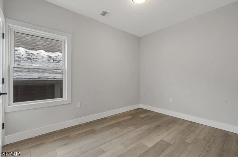 626 South 20th Street, Unit 3 Newark, NJ 07103 - Photo 8 of 13 a view of a room that has a window in it