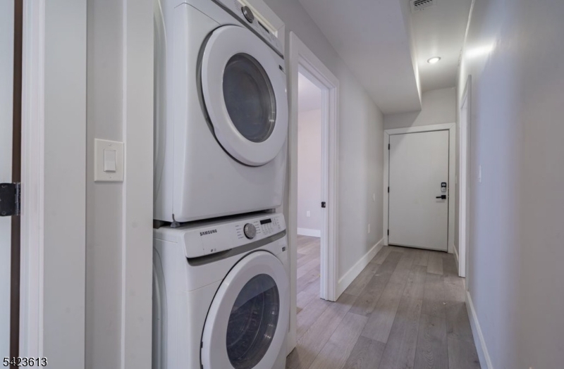 626 South 20th Street, Unit 3 Newark, NJ 07103 - Photo 9 of 13 a view of a hallway with washer and dryer