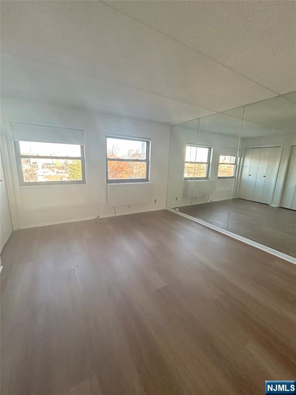 1600 Center Avenue, Unit 5A Fort Lee, NJ 07024 - Photo 7 of 10 an empty room with windows