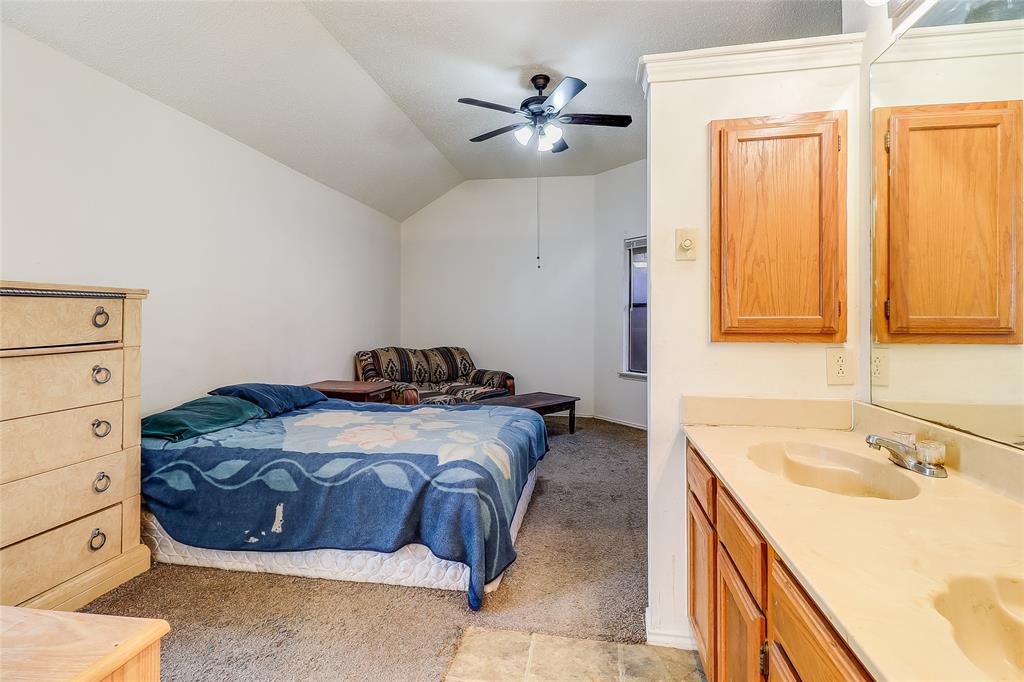1728 Hackamore Street Mesquite, TX 75149 - Photo 11 of 22 Bedroom featuring light carpet, lofted ceiling, and ceiling fan