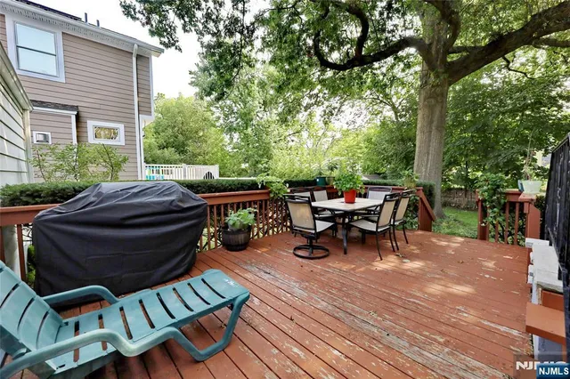 a view of a patio with table and chairs