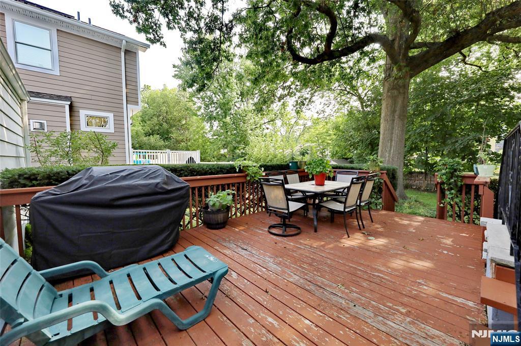 136 Elm Street Cresskill, NJ 07626 - Photo 15 of 24 a view of a patio with table and chairs