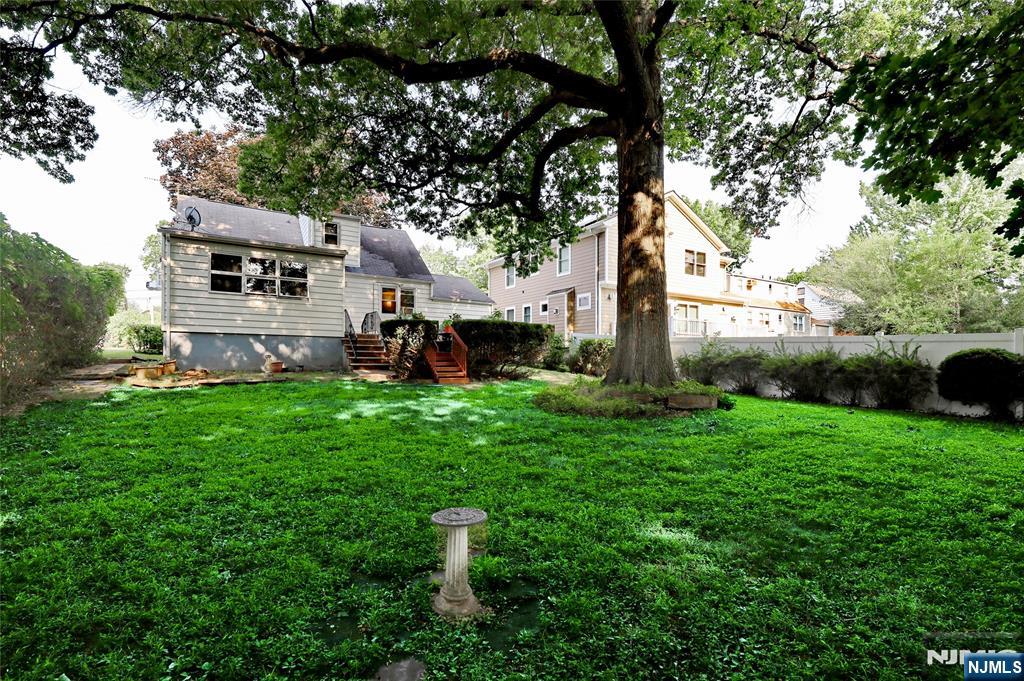 136 Elm Street Cresskill, NJ 07626 - Photo 20 of 24 a front view of a house with garden