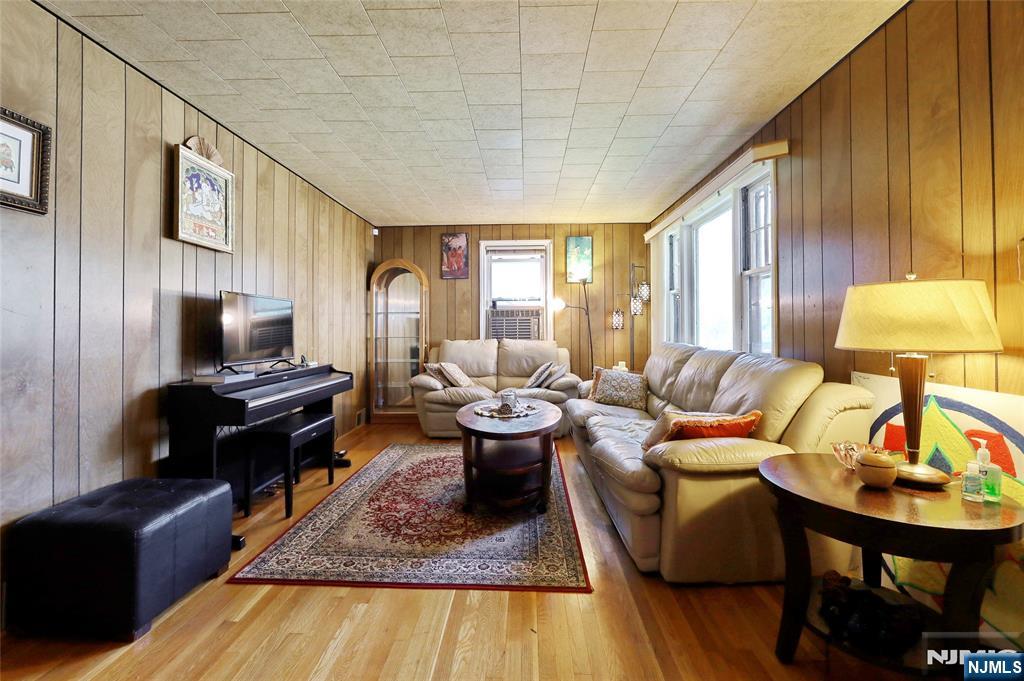 136 Elm Street Cresskill, NJ 07626 - Photo 4 of 24 a living room with furniture and a table