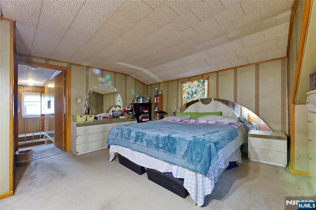 136 Elm Street Cresskill, NJ 07626 - Photo 8 of 24 a bed sitting in a spacious bedroom next to a window