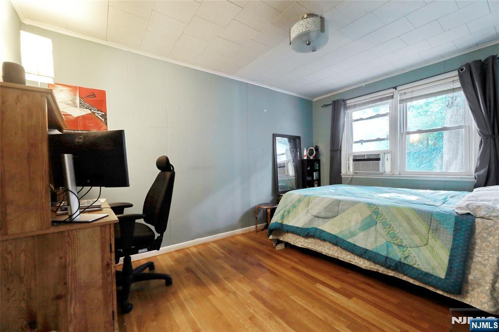 136 Elm Street Cresskill, NJ 07626 - Photo 10 of 24 a bed sitting in a bedroom next to a window