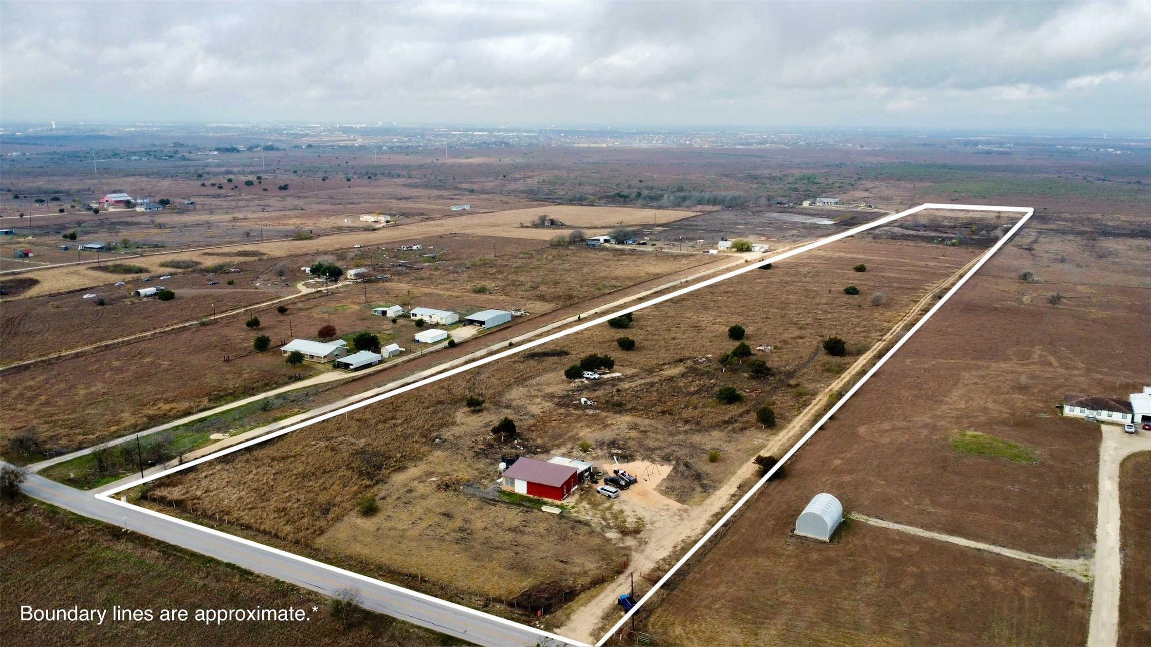 14024 Graef Road Buda, TX 78610 - Photo 11 of 12 Overview of rural landscape featuring property parcel outlined