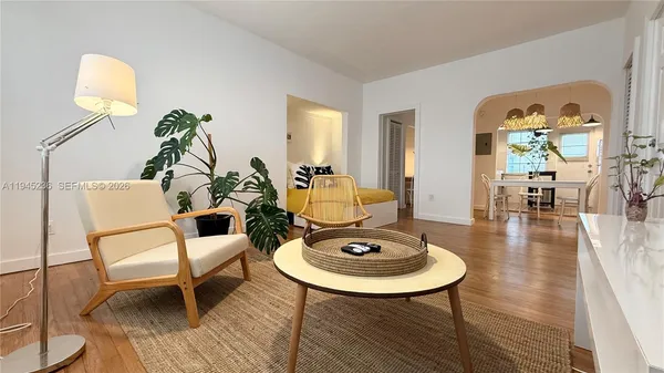 a living room with furniture and a table