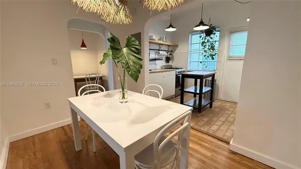 a view of kitchen island a sink and living room