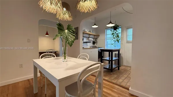 a dining room with furniture and chandelier