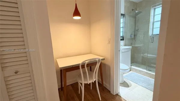 a bathroom with a shower and a sink