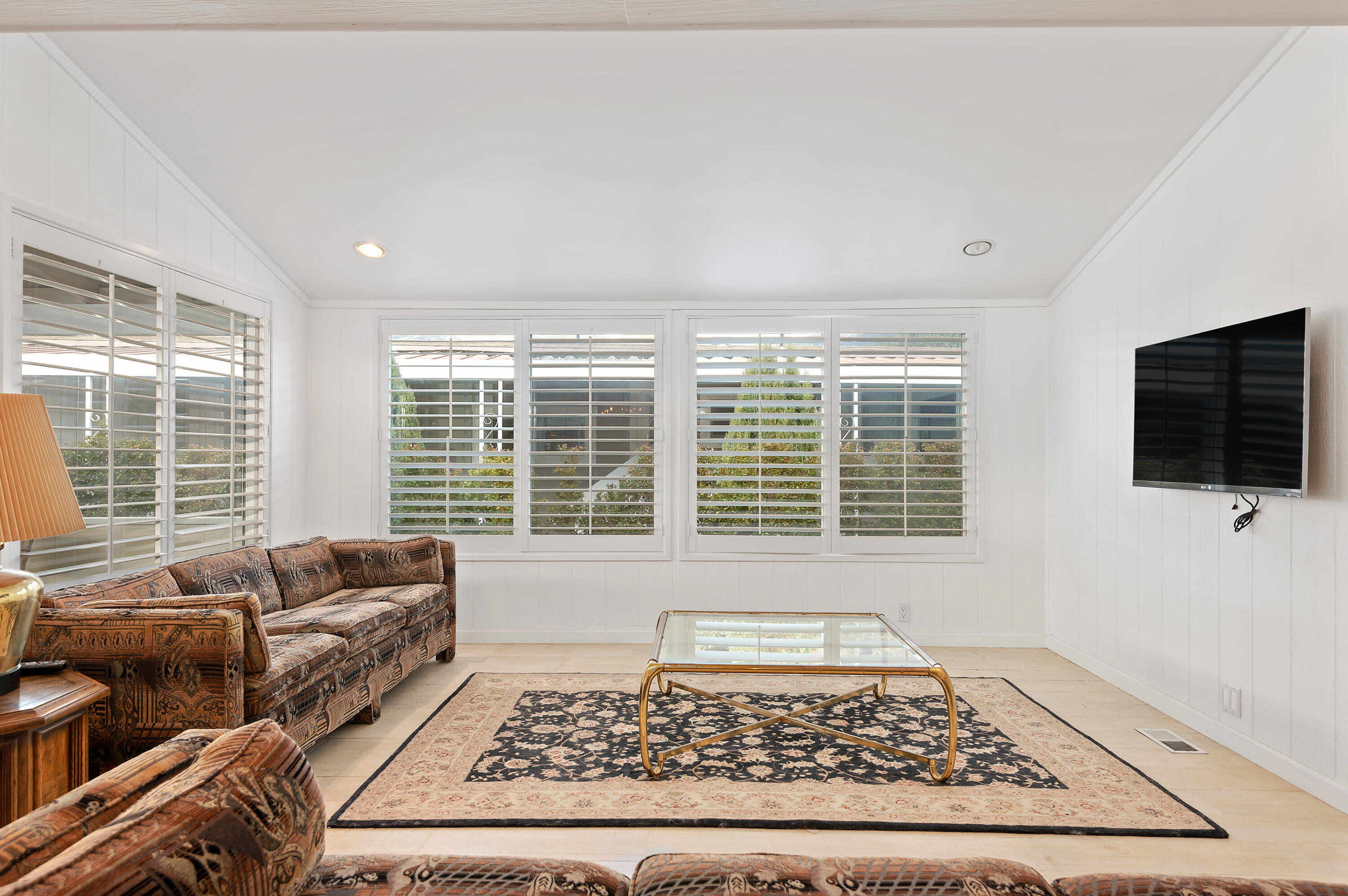 340 Old Mill Road, Unit SPC 16 Santa Barbara, CA 93110 - Photo 12 of 28 a living room with a couch a rug and a large window