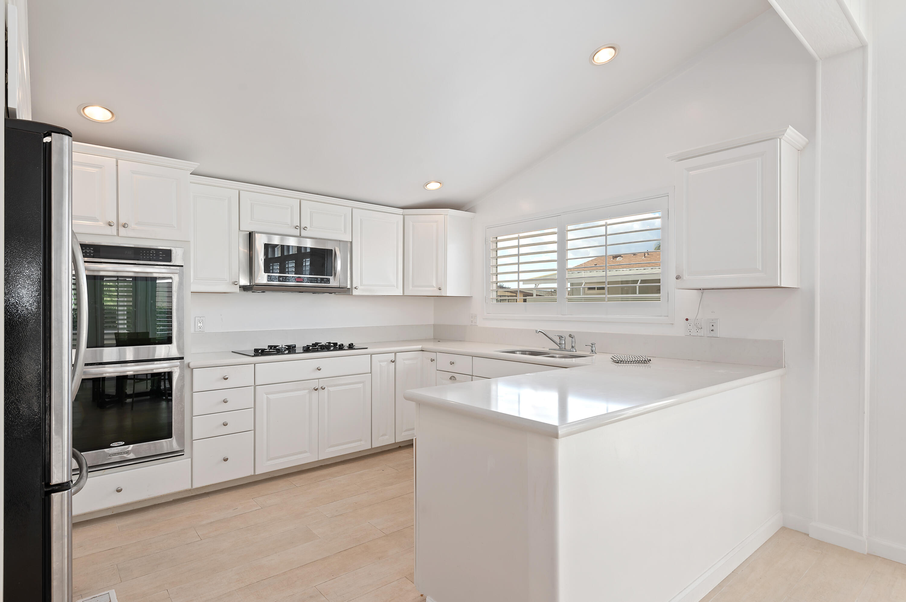 340 Old Mill Road, Unit SPC 16 Santa Barbara, CA 93110 - Photo 9 of 28 a kitchen with stainless steel appliances granite countertop a stove sink and microwave