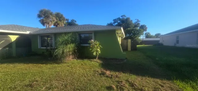 a view of a house with a garden
