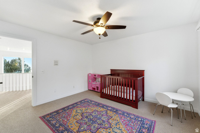 1878 East Ridge Point Drive Bountiful, UT 84010 - Photo 37 of 92 Bedroom with a crib, light colored carpet, and a ceiling fan