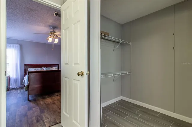 a bedroom with bed and window