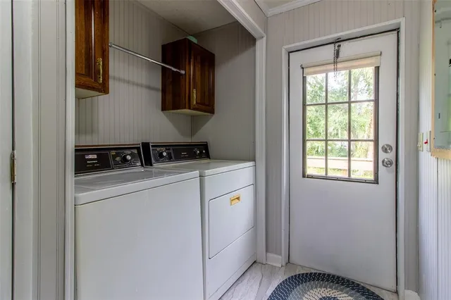 a view of a lake with a yard and trees