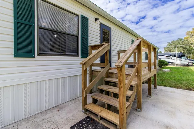 an aerial view of a house with a yard lake view