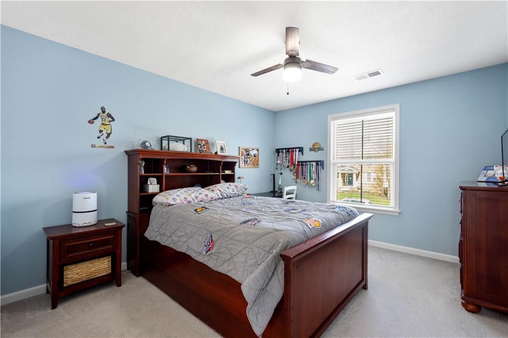 4528 Walnut Ridge Circle McDonald, PA 15057 - Photo 28 of 50 a bed sitting in a spacious bedroom next to a window