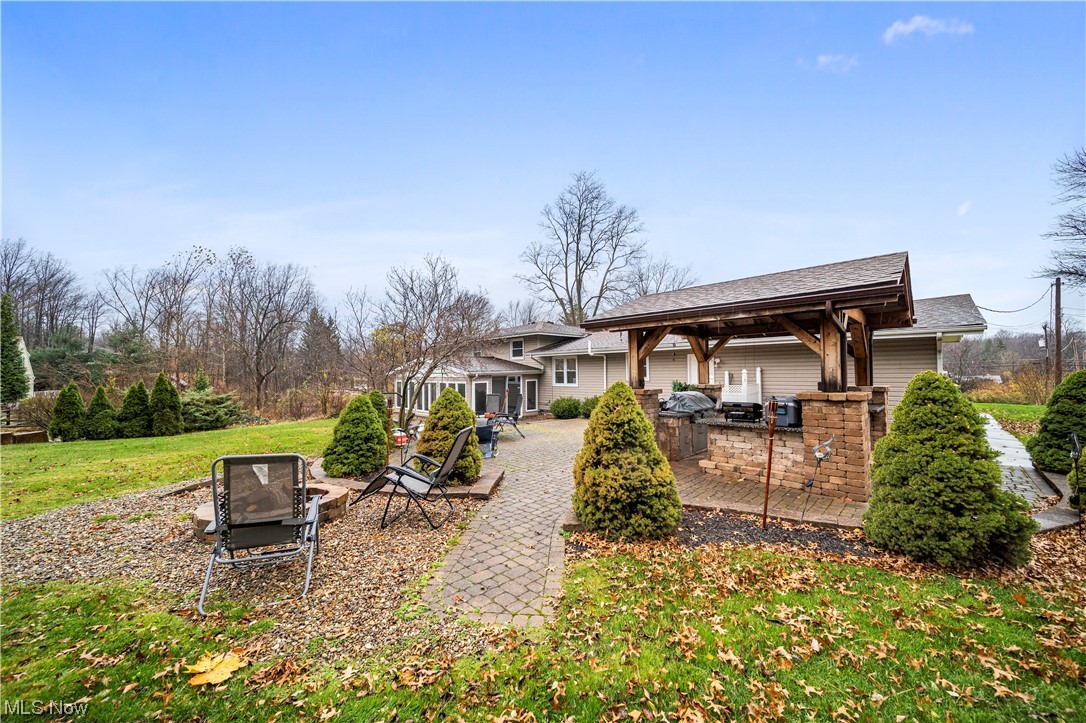 9944 Hoose Road Mentor, OH 44060 - Photo 31 of 35 View of yard featuring a patio area and area for grilling