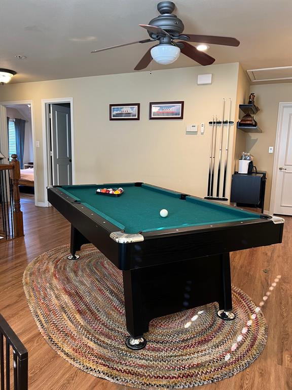1625 Roma Lane Allen, TX 75013 - Photo 10 of 10 Recreational area featuring wood-finish flooring, light-toned walls, and a ceiling fan with integrated lighting