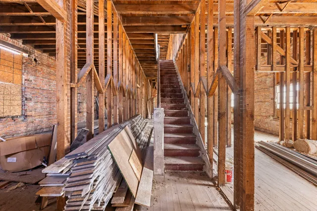 a view of balcony with wooden floor and stairs