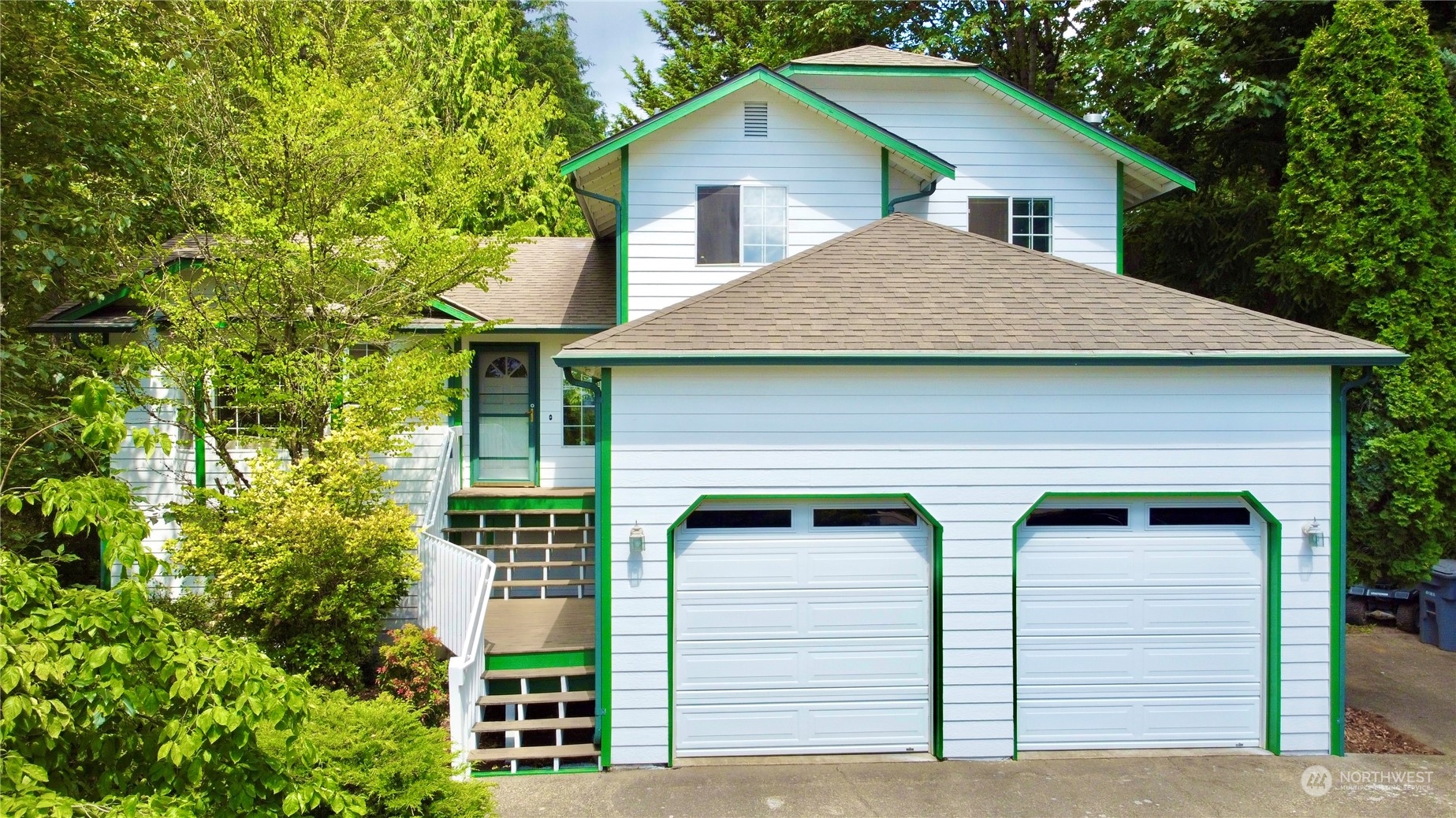 750 South 55th Street Renton, WA 98055 - Photo 1 of 31 a front view of a house with garden