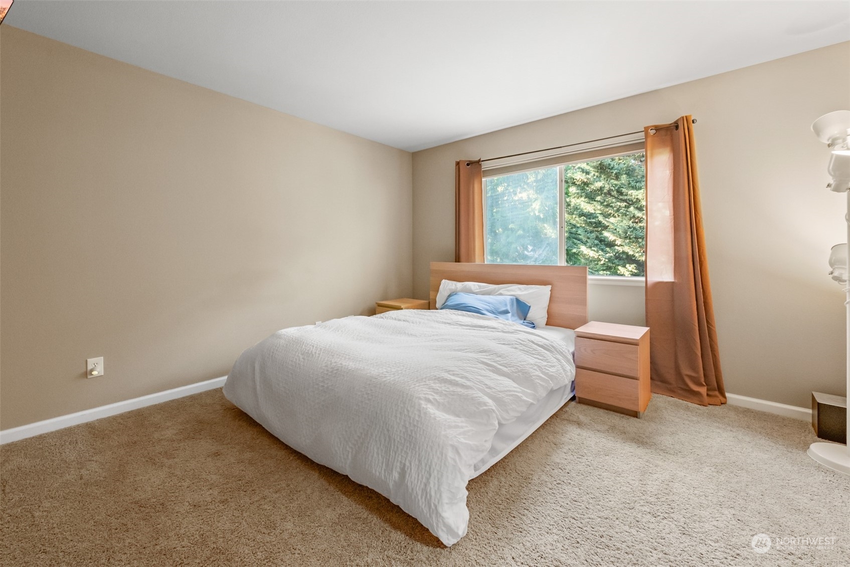 750 South 55th Street Renton, WA 98055 - Photo 17 of 31 a large bed sitting in a bedroom next to a window