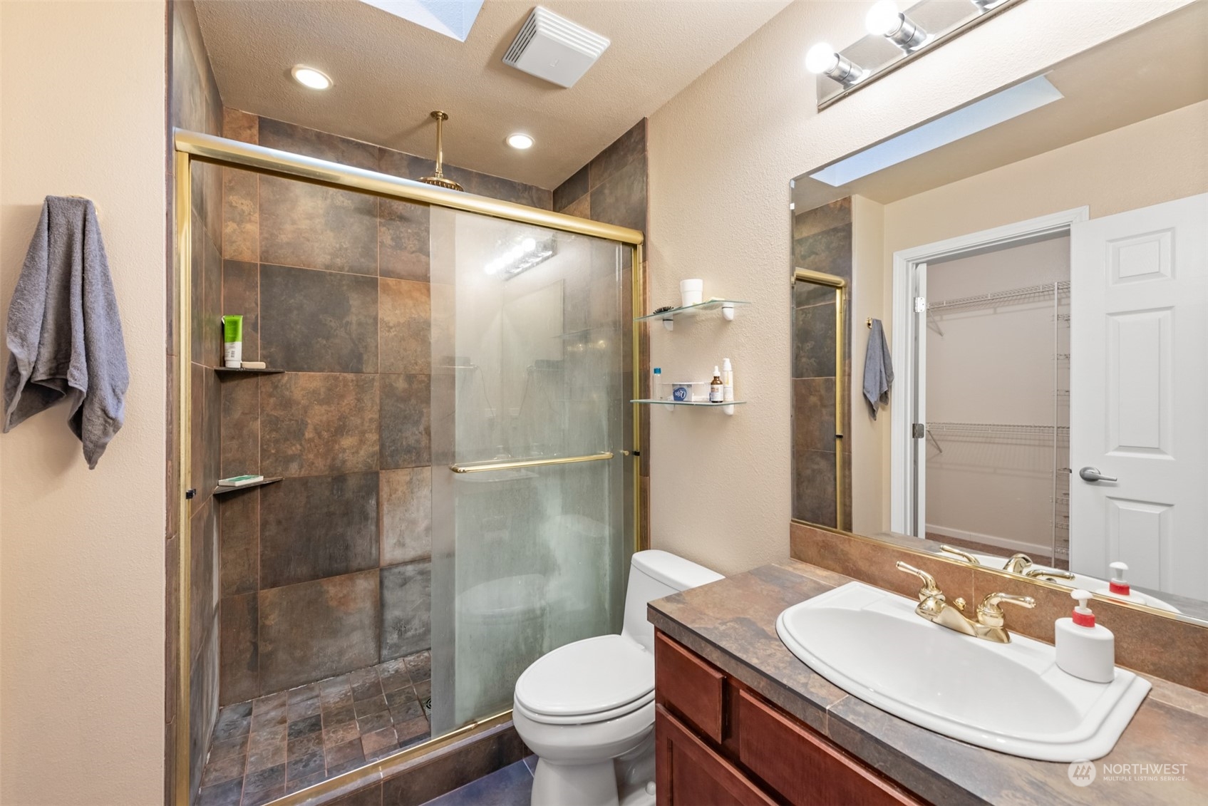 750 South 55th Street Renton, WA 98055 - Photo 19 of 31 a bathroom with a sink toilet and shower