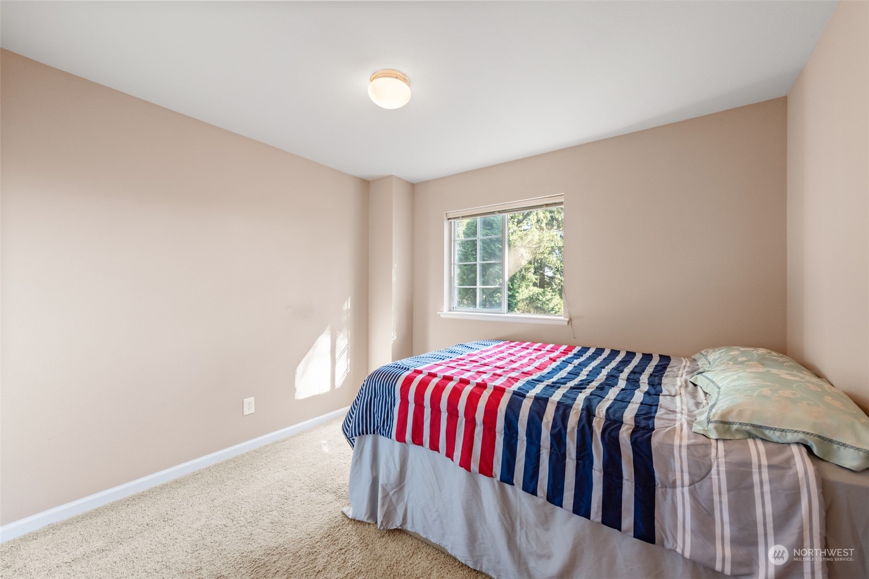 750 South 55th Street Renton, WA 98055 - Photo 21 of 31 a bed sitting in a bedroom next to a window