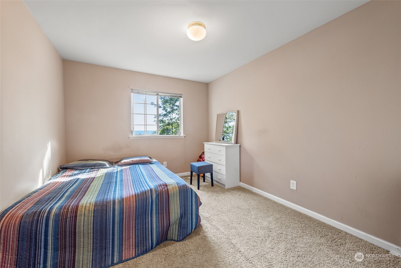 750 South 55th Street Renton, WA 98055 - Photo 22 of 31 a bedroom with a bed and window