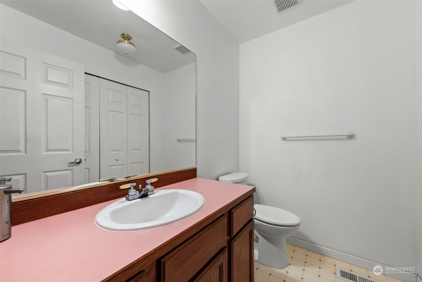 750 South 55th Street Renton, WA 98055 - Photo 24 of 31 a bathroom with a sink and a mirror