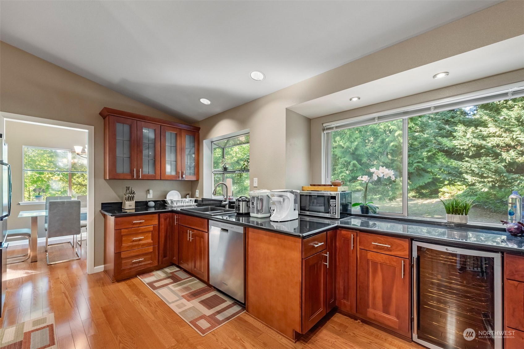 750 South 55th Street Renton, WA 98055 - Photo 8 of 31 a kitchen with stainless steel appliances granite countertop sink stove top oven and cabinets