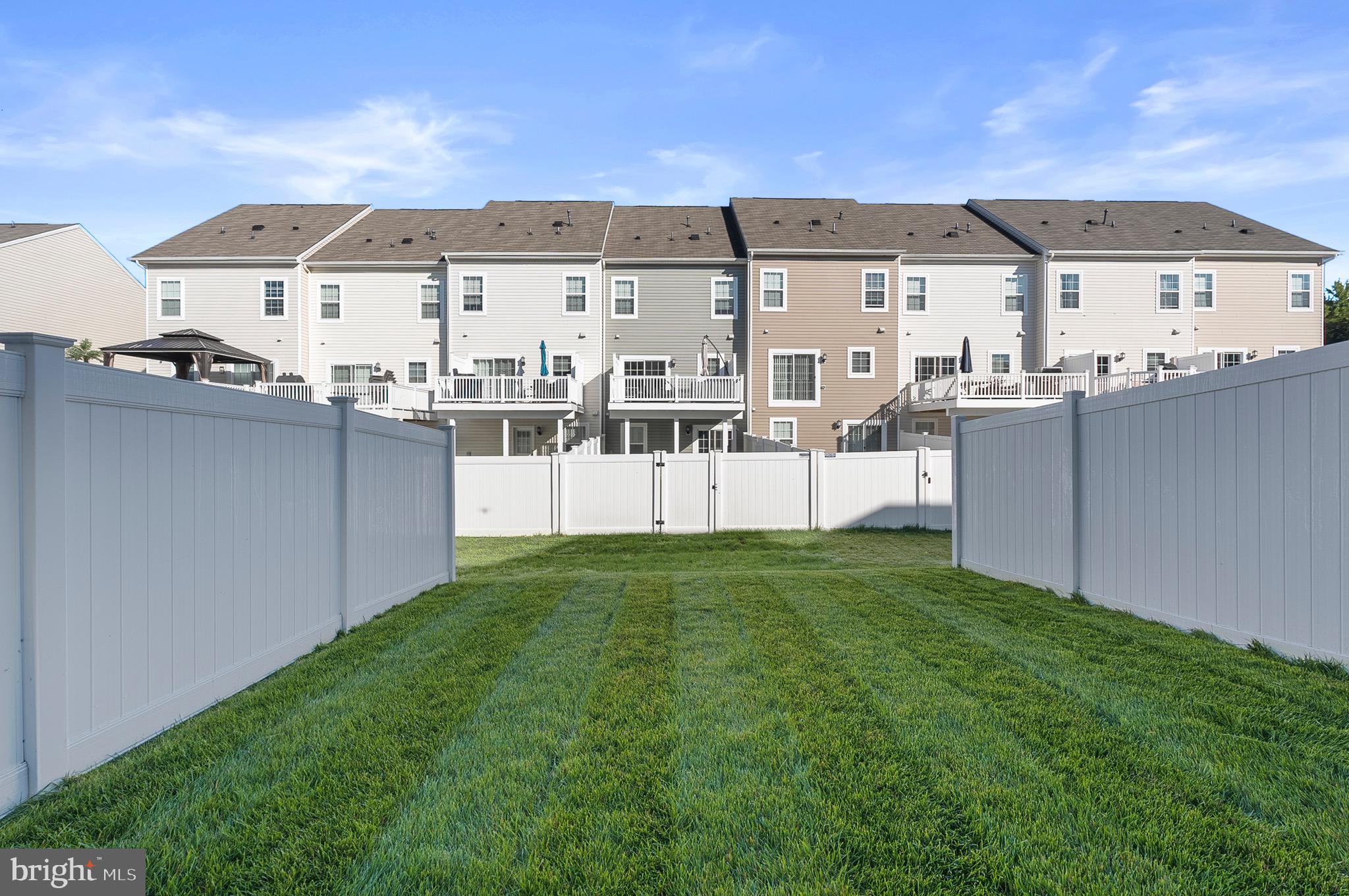 534 Calvert Way Aberdeen, MD 21001 - Photo 20 of 26 a view of a large building with a yard