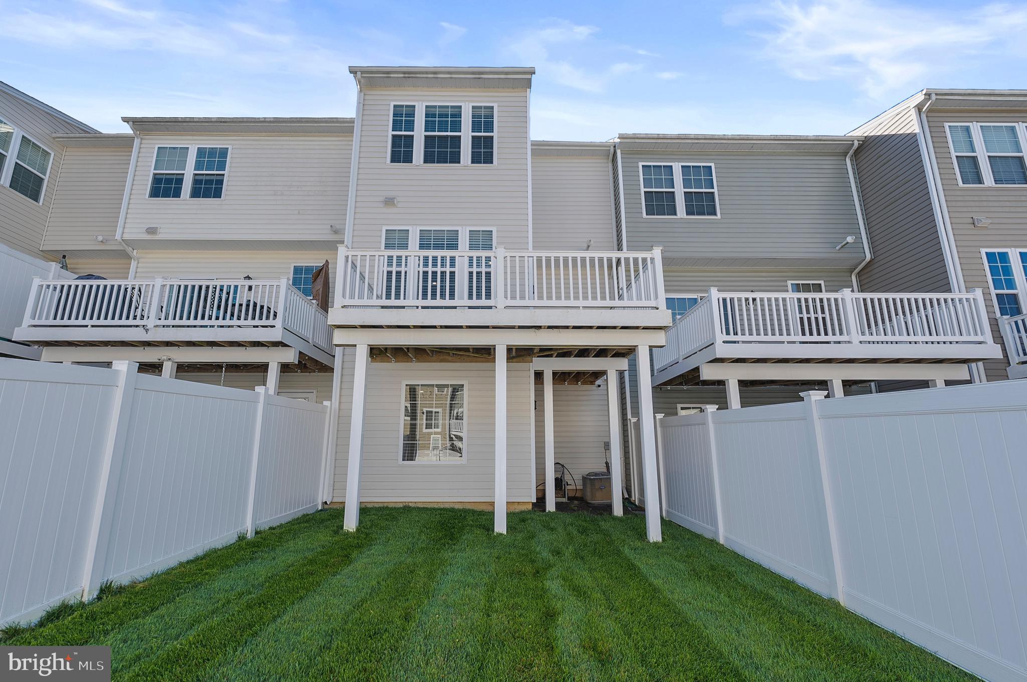 534 Calvert Way Aberdeen, MD 21001 - Photo 21 of 26 a view of a house with windows and yard