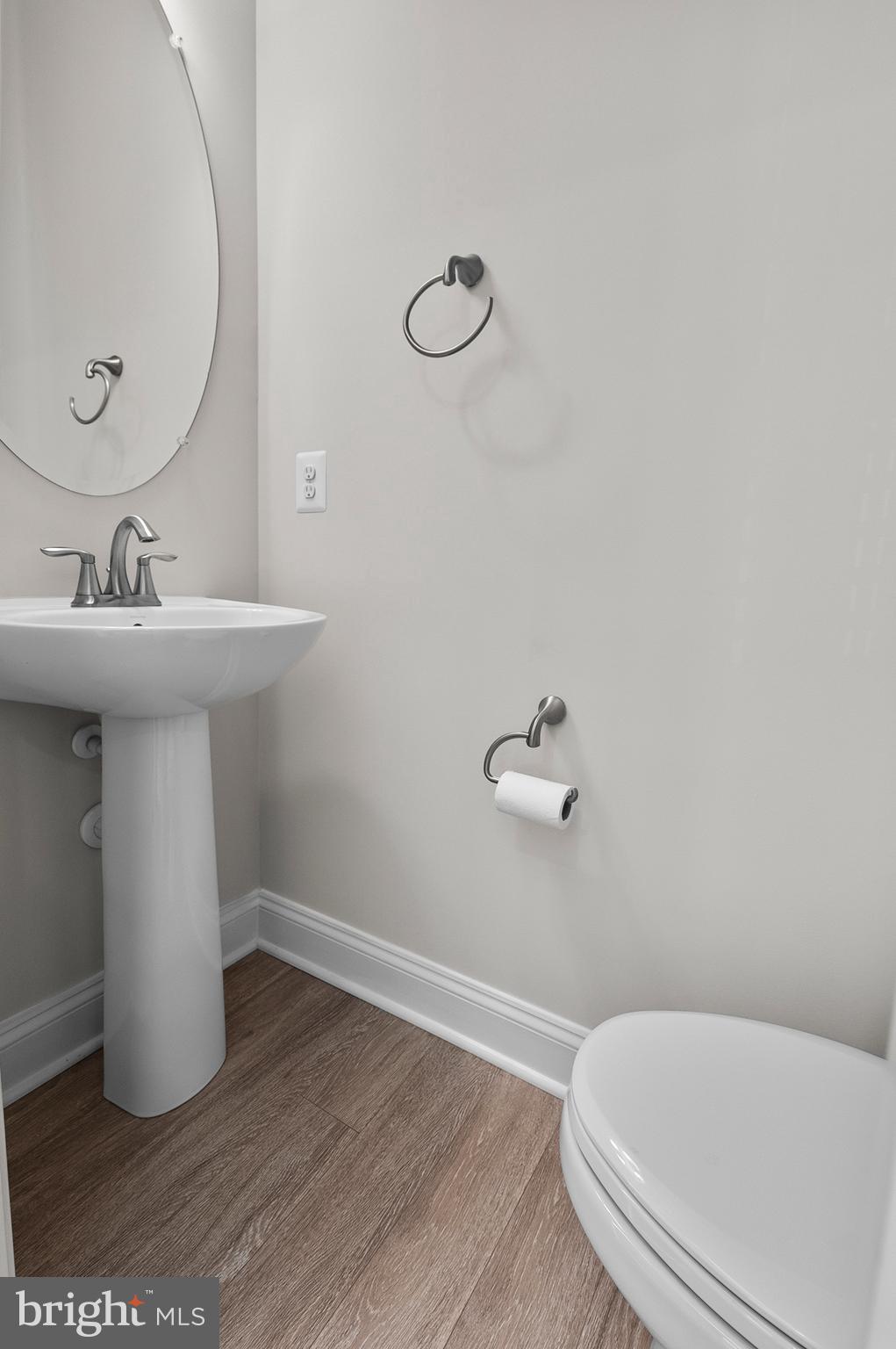 534 Calvert Way Aberdeen, MD 21001 - Photo 4 of 26 a bathroom with a sink and a mirror