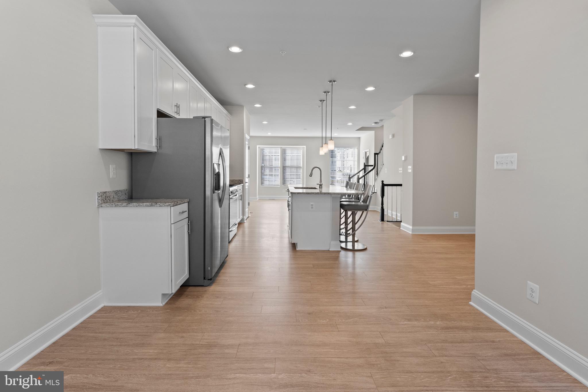 534 Calvert Way Aberdeen, MD 21001 - Photo 6 of 26 a view of kitchen with refrigerator stove and wooden floor