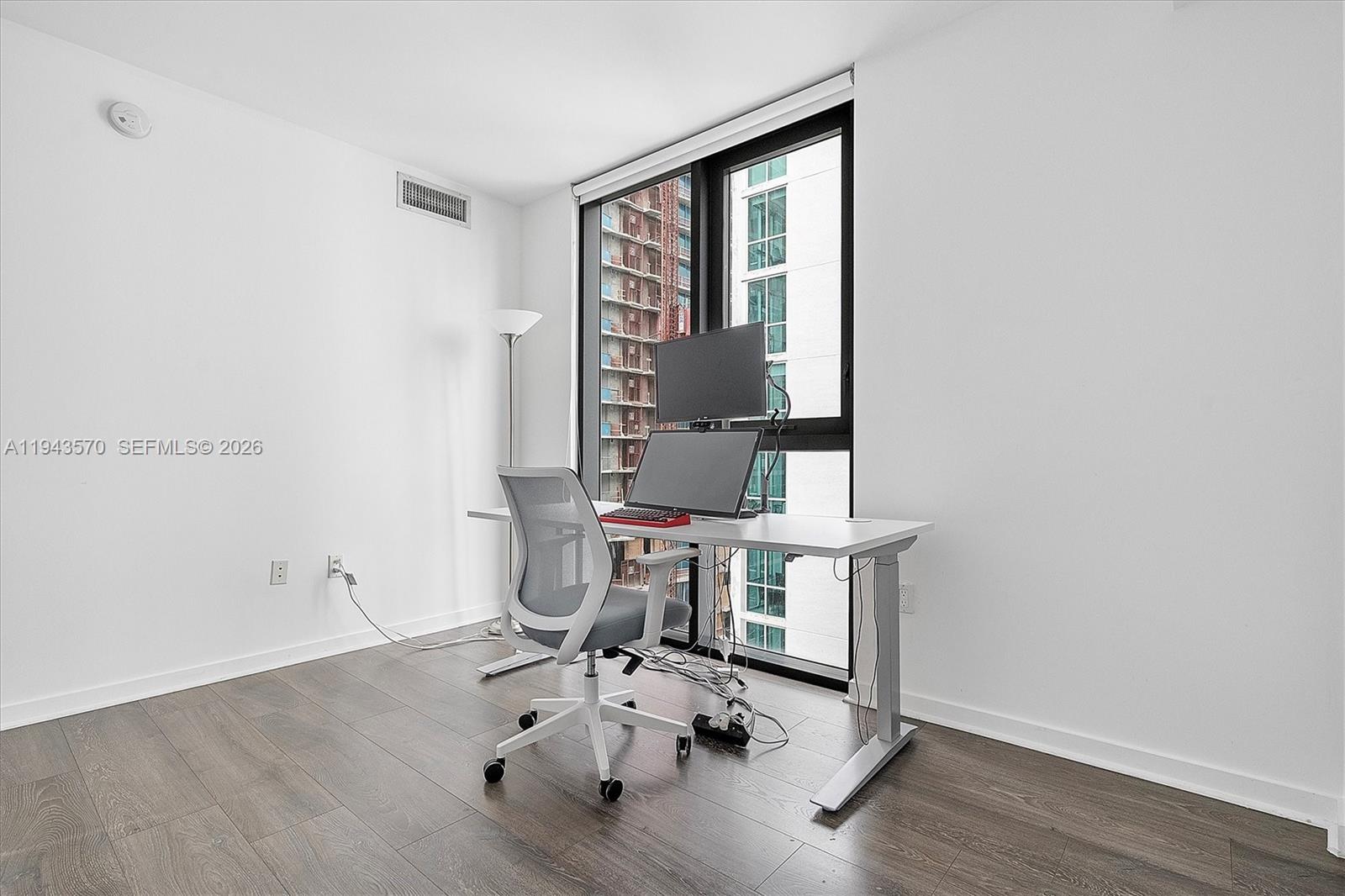 31 Southeast 6th Street, Unit 2008 Miami, FL 33131 - Photo 10 of 21 a room with a table and chairs